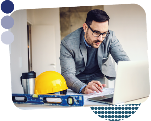 Male surveyor working on a digital learning course on his laptop computer